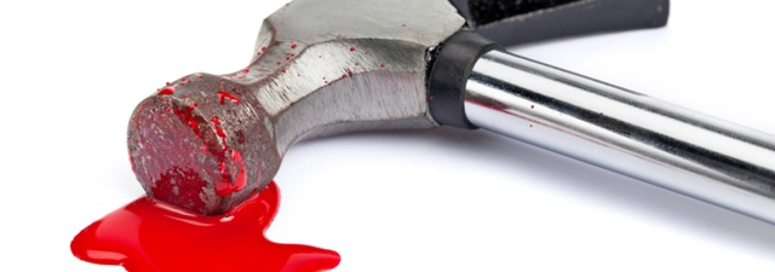 Using a hammer.
